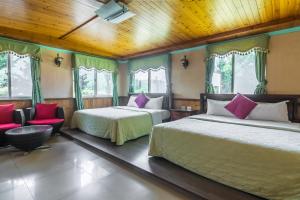 Postel nebo postele na pokoji v ubytování Kenting Maya-House B&B