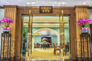 an entrance to a hotel with a dining room at Shangri-La Hangzhou in Hangzhou