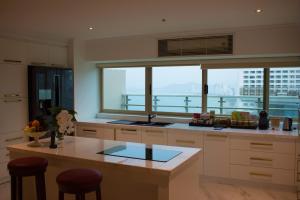 a large kitchen with a view of a city at Diamond Bay Hotel in Nha Trang