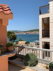 a balcony of a building with a view of the water at Apartments Villa Zica in Trogir