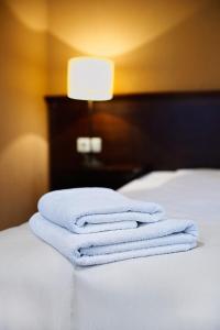 Łóżko lub łóżka w pokoju w obiekcie Hotel Nowodwory