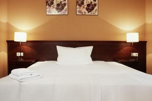 Łóżko lub łóżka w pokoju w obiekcie Hotel Nowodwory