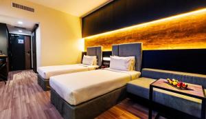 Postel nebo postele na pokoji v ubytování Hotel Armada Petaling Jaya