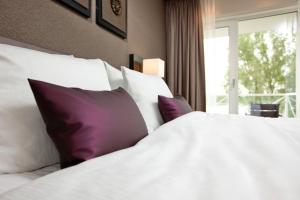 Postel nebo postele na pokoji v ubytování Hotel Thermen Bussloo - Apeldoorn