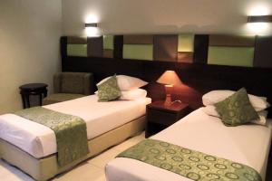 Letto o letti in una camera di Hotel Alma