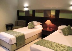 Letto o letti in una camera di Hotel Alma