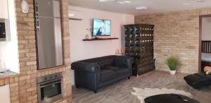 A television and/or entertainment centre at Duna Dráva Vendégház