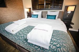 Postel nebo postele na pokoji v ubytování Hotel Thermen Bussloo - Apeldoorn