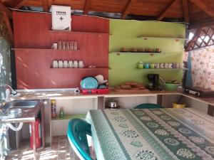 a toy kitchen with a table and a sink at La Botezatu in Tuzla +22 photos