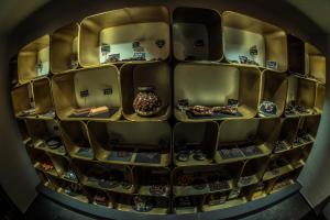 a room with shelves with vases on them at Hotel Ciasa Salares in San Cassiano