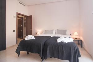 Postel nebo postele na pokoji v ubytování BET Apartments - Canovas rooms