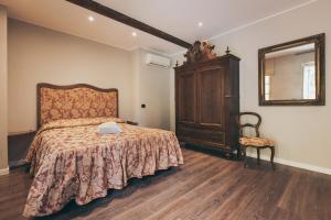 Postel nebo postele na pokoji v ubytování Residenza San Vito