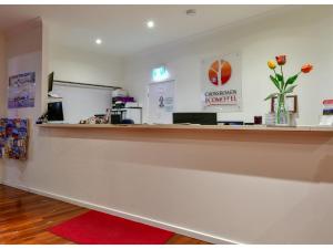 
a room with a white counter top and a large window at Crossroads Ecomotel in Port Augusta
