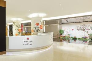 a room with flowers on the wall and a counter at Caesar Park Hotel Taipei in Taipei