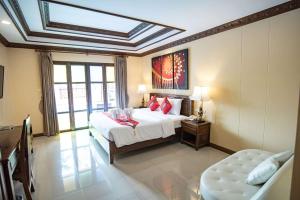 Postel nebo postele na pokoji v ubytování The LD Pattaya Hotel + 22 fotografií