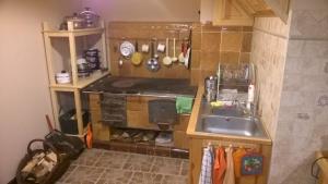 a small kitchen with a sink and a stove at AgroKorytnica in Stara Korytnica
