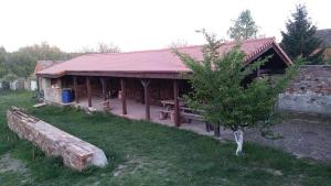 a pavilion with a bench in front of a building at AgroKorytnica in Stara Korytnica