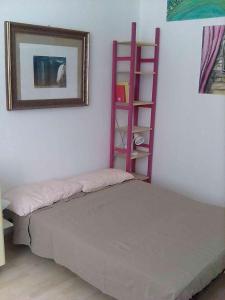 Łóżko lub łóżka w pokoju w obiekcie Flat in Genova