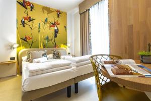 Ένα ή περισσότερα κρεβάτια σε δωμάτιο στο Costa Rica Bibione Aparthotel