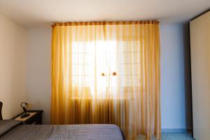 Postel nebo postele na pokoji v ubytování B&B La Casa nel Borgo