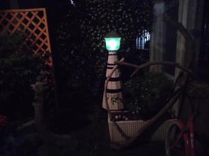 a street light with a green light on it at B&B Sottocoperta in Biella