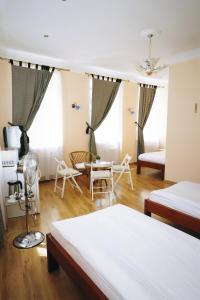 Postel nebo postele na pokoji v ubytování Apartamenti DVINSKA
