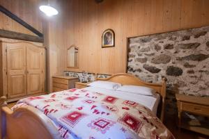 A bed or beds in a room at Baita Tomaselli