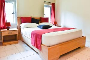 Postel nebo postele na pokoji v ubytování Tamarin Chambres d'Hotes