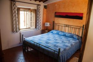 Postel nebo postele na pokoji v ubytování Dimora nel Chianti