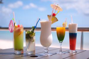 a table topped with four different types of drinks at Coral Strand Smart Choice in Beau Vallon