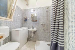a bathroom with a toilet and a sink at Miso Apartment in Budapest