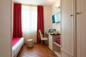 Letto o letti in una camera di Simon Hotel