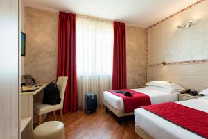 Letto o letti in una camera di Simon Hotel