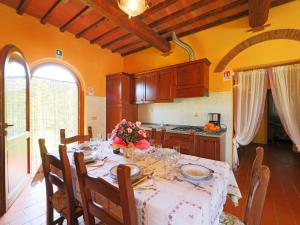 a dining room with a table in a kitchen at Holiday Home Il Masso-1 by Interhome in La Collina