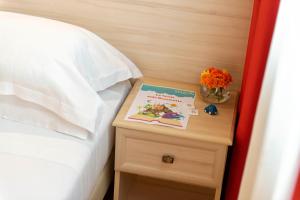 Letto o letti in una camera di Simon Hotel