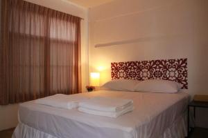 Postel nebo postele na pokoji v ubytování Baantalaywhan Resort