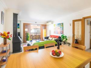 a living room with a table with a plate of fruit on it at Apartment Mariners 2 by Interhome in Alcudia