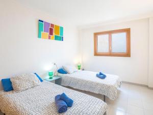 A bed or beds in a room at Apartment Mariners 2 by Interhome