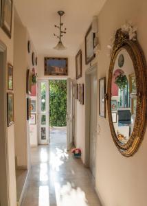 a hallway with a mirror on the wall at Ideal Studios in Amoudara Herakliou