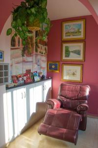 a living room with a couch and a chair at Ideal Studios in Amoudara Herakliou