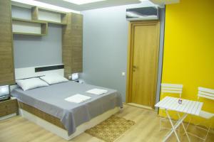 Postel nebo postele na pokoji v ubytování Batumi Hotel R&M