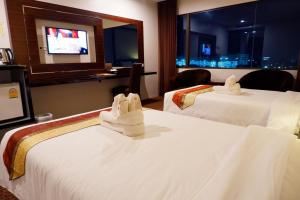 เตียงในห้องที่ Siam Oriental Hotel