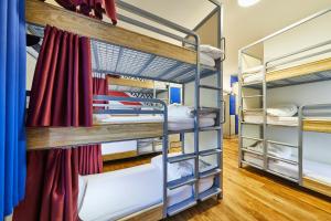a room with bunk beds in a hostel at St Christopher's Inn Village - London Bridge in London