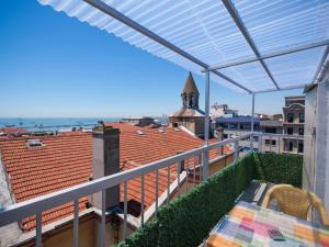 a balcony with a table and a view of a city at Oban Suites Istanbul in Istanbul