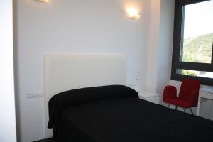 Postel nebo postele na pokoji v ubytování Hostal Tres Campanas