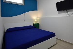 Posteľ alebo postele v izbe v ubytovaní Covo dei Marinai