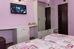 Postel nebo postele na pokoji v ubytování Kirios Hotel