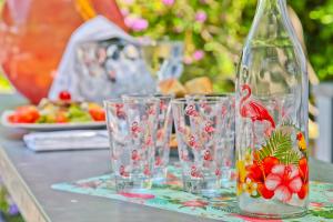a group of wine glasses sitting on a table at Hôtel La Villa Cap d’Antibes in Juan-les-Pins
