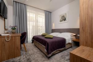 Postel nebo postele na pokoji v ubytování Hotel Nova