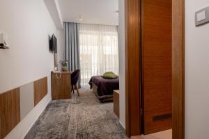 TV a/nebo společenská místnost v ubytování Hotel Nova